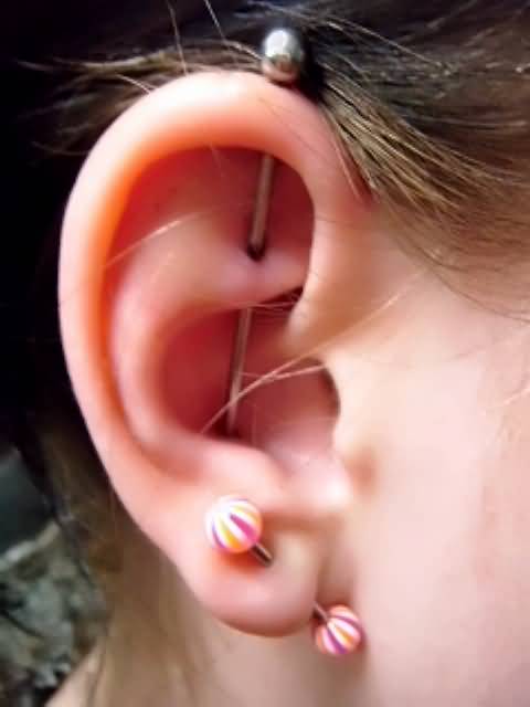Vertical Industrial Piercing On Right Ear For Girls