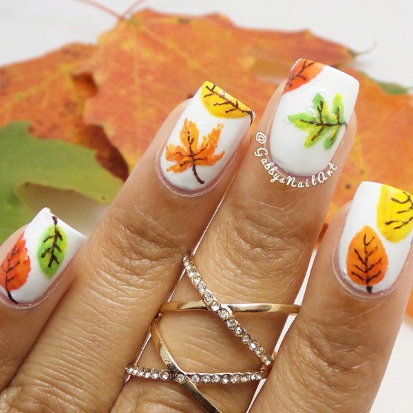 White Nails With Autumn Leaves Nail Art Design Idea