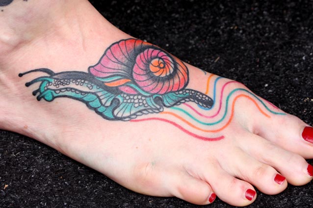 Wonderful Colored Snail Crawling With Rainbow Lines Tattoo On Foot