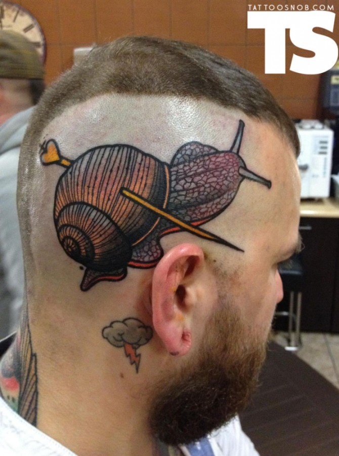 Wonderful Hair Stick Ripped Snail Shell Tattoo On Side Head