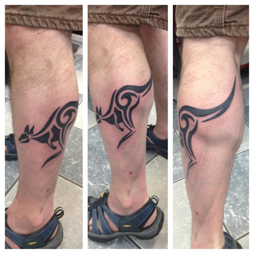 Wonderful Tribal Jumping Kangaroo Tattoo On Left Leg