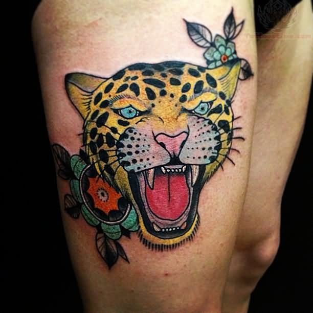 Yellow Ink Angry jaguar Head Traditional Tattoo On Thigh