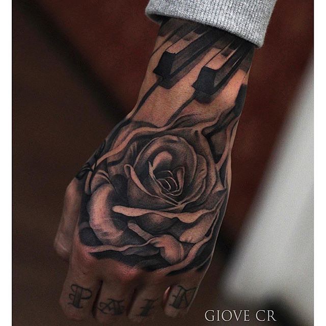 Amazing Black And Grey Piano Keys With Rose Tattoo On Hand By Giovanni rossi