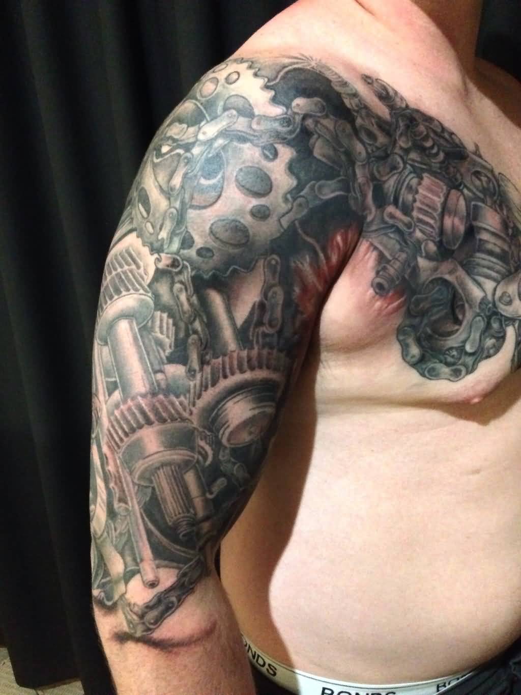 Amazing Grey Realistic Biomechanical Tattoo On Chest To Arm By Skink28