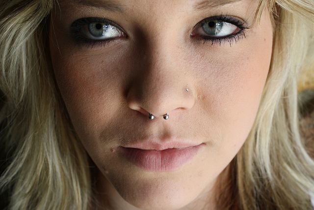 Amazing Left Nostril And Septum Piercing With Circular Barbell