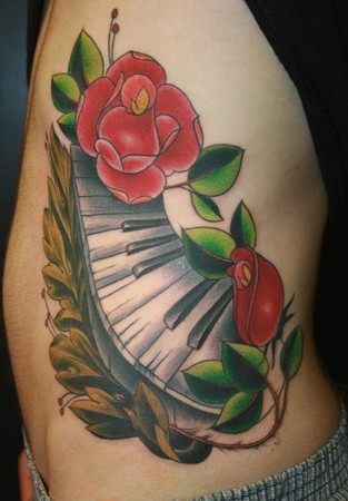 Amazing Red Flowers With Piano Keys Colorful Tattoo On Side Rib