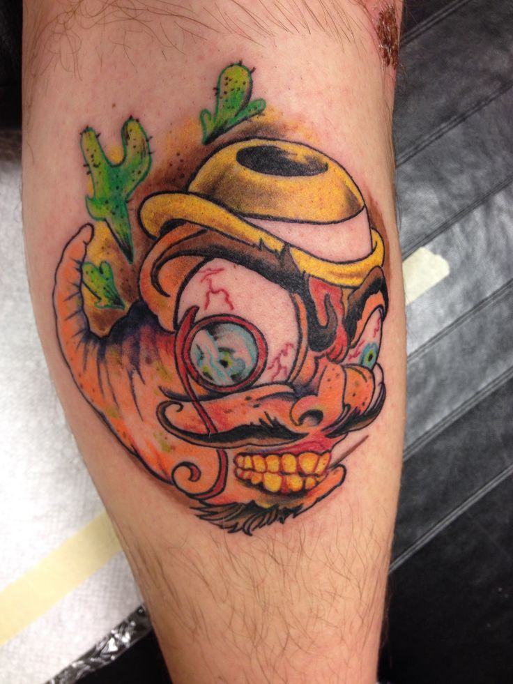 Angry Worm Wearing Hat And Monocle Tattoo