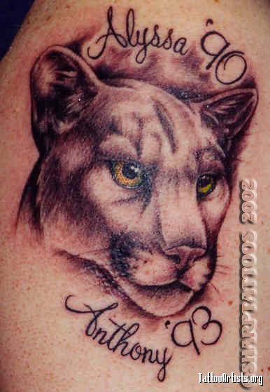 Attractive Puma Face With Lettering Tattoo