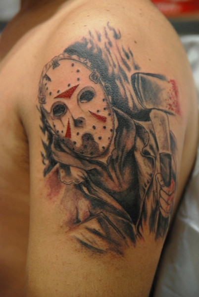 Awesome Grey Ink Jason Holding Axe Tattoo On Left Shoulder