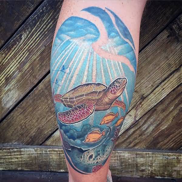 Awesome Colorful Saltwater Fishes And Turtle In Deep Sea Tattoo On Leg