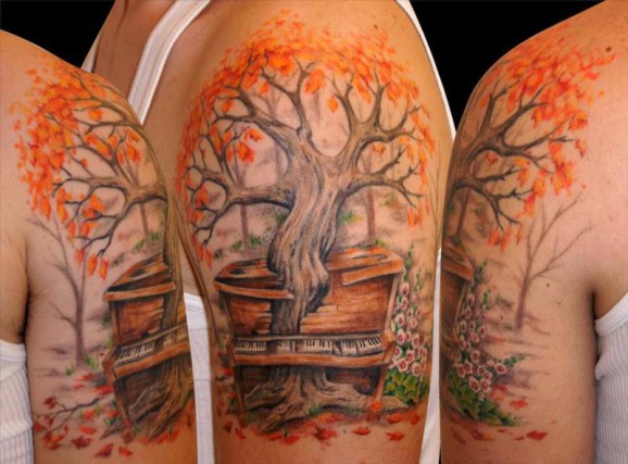 Awesome Fall Tree Growing Into Piano Color Tattoo On Left Shoulder