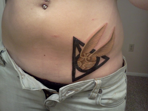 Awesome Golden Snitch In Hallows Symbol Tattoo On Hip