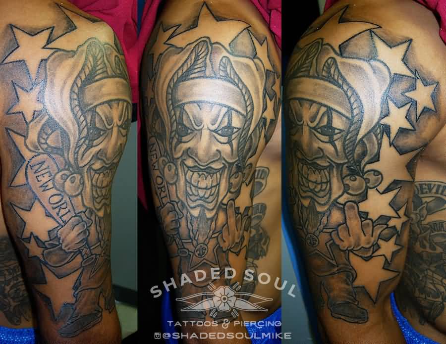 Awesome Grey And Black Evil Jester With Stars Tattoo On Right Half Sleeve