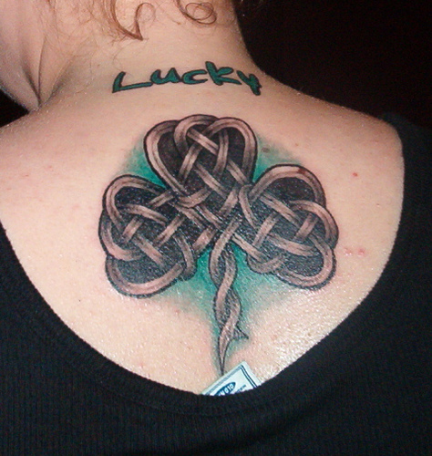 Awesome Grey Color Celtic Shamrock Tattoo On Upper Back