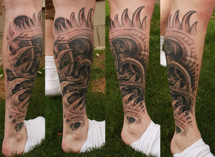 Awesome Grey Ink Biomechancial Gears Tattoo On Back Leg