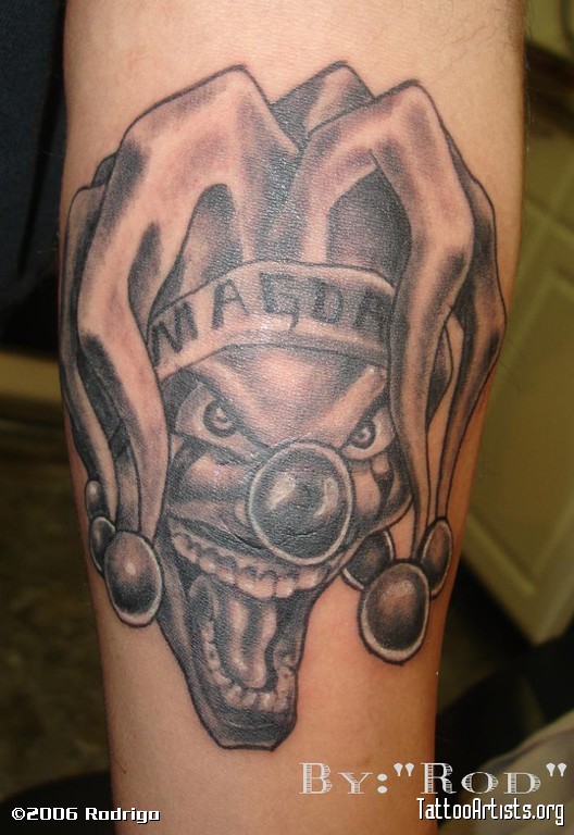 Awesome Grey Ink Evil Jester Head Tattoo On Arm Sleeve