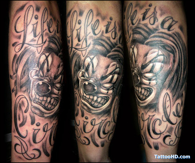 Awesome Grey Ink Evil Jester With Lettering Tattoo On Arm Sleeve