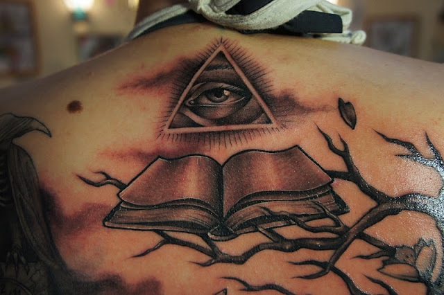 Awesome Grey Triangle Eye With Book On Tree Branch Tattoo On Upper Back