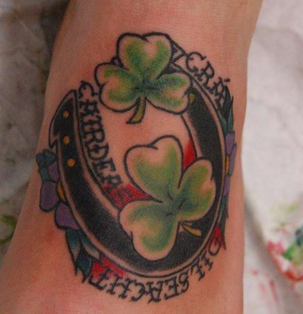 Awesome Shamrock Leaves With Horse Shoe Traditional Tattoo