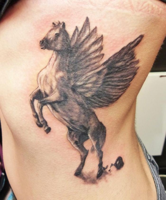 Awesome White And Black Pegasus Tattoo On Side Rib