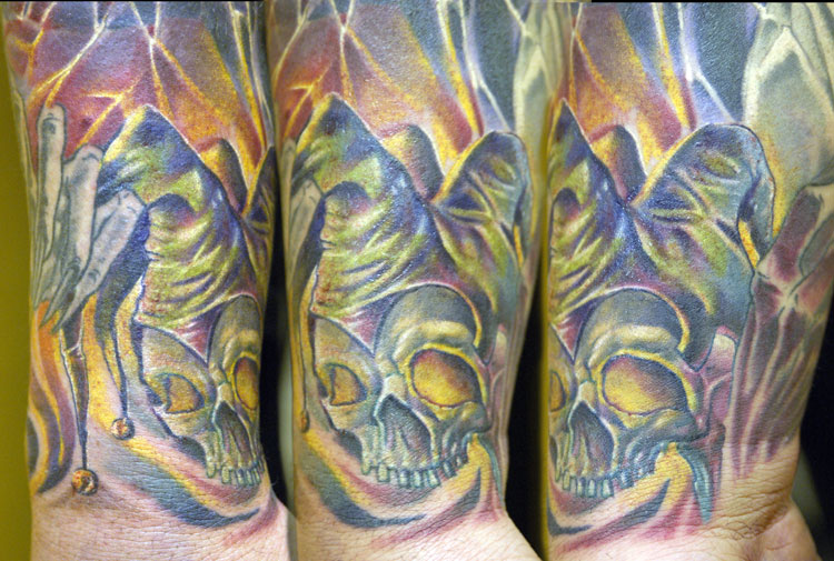 Awful Jester Skull Color Tattoo On Half Sleeve