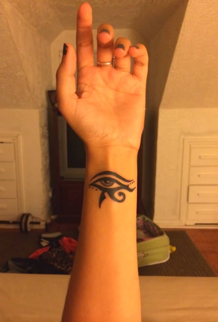 Beautiful Black Horus Eye Tattoo On Wrist For Girls