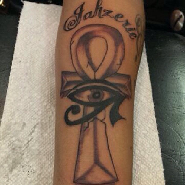 Beautiful Grey And Black Ankh And Horus Eye Tattoo