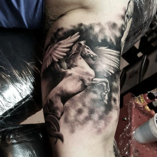 Beautiful Grey Flying Pegasus Tattoo On Bicep