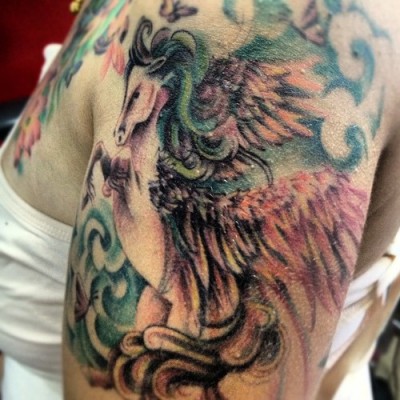 Beautiful Jumping Pegasus Jumping Tattoo On Left Shoulder