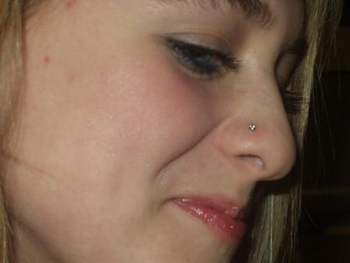 Beautiful Smiling Girl Have Nostril Piercing