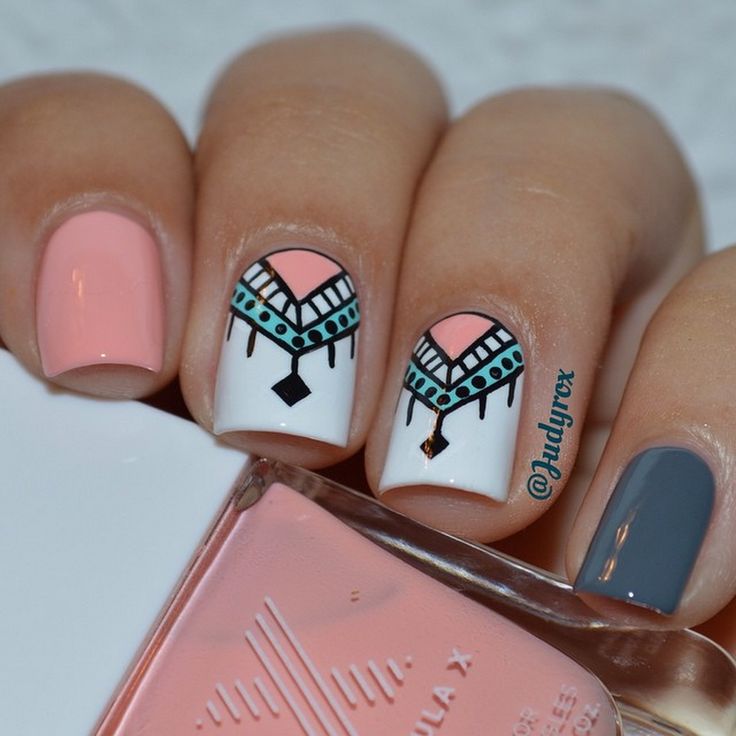 Beautiful White Base With Pink And Blue Tribal Nail Art