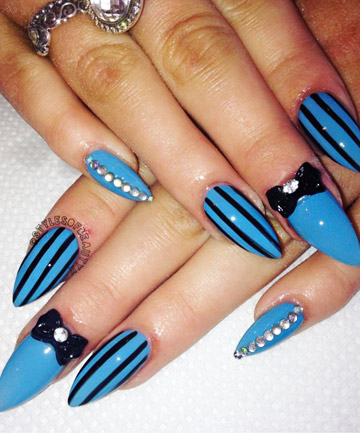 Black And Blue Stripes Design Stiletto Nail Art With Black 3D Bow