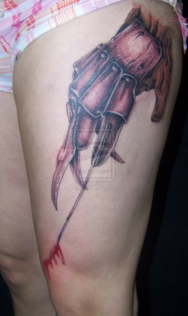 Black And Grey Freddy Krueger Glove Scratch Tattoo On Left Thigh