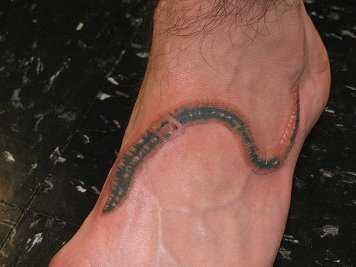 Black And Red Realistic Worm Tattoo On Foot
