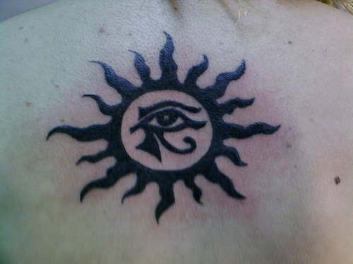 Black Color Horus Eye In Sun Tattoo