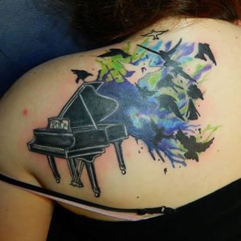 Black Grand Piano With Color Splash And Birds Tattoo On Back Shoulder