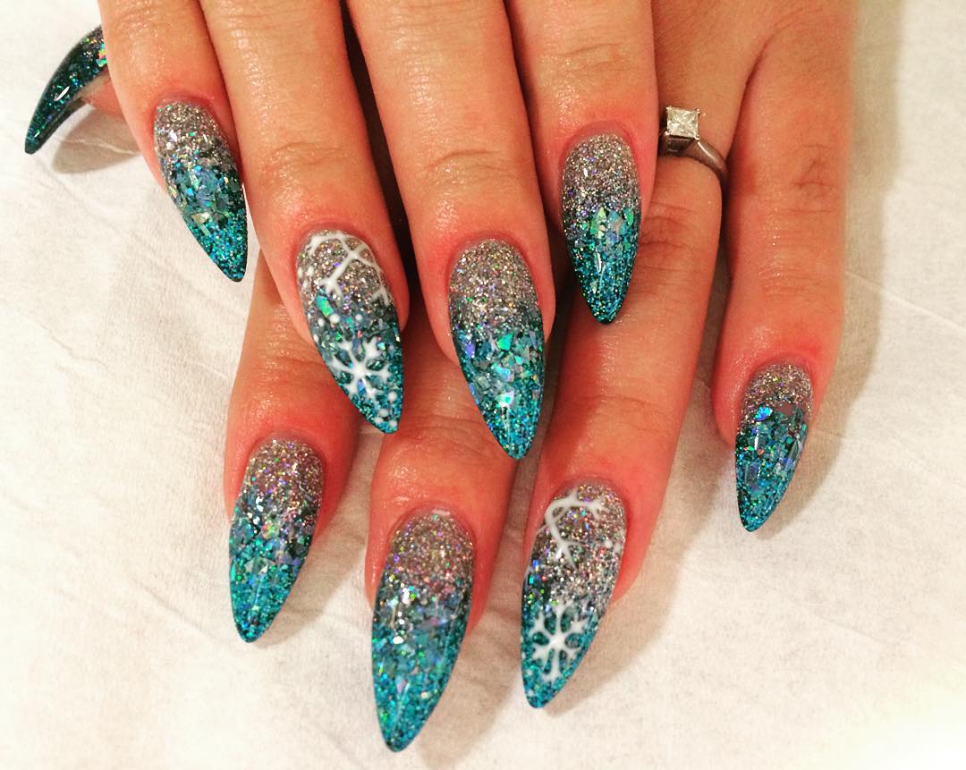 Blue And Silver Glitter Gradient Nail Art With White Snowflakes Design Idea
