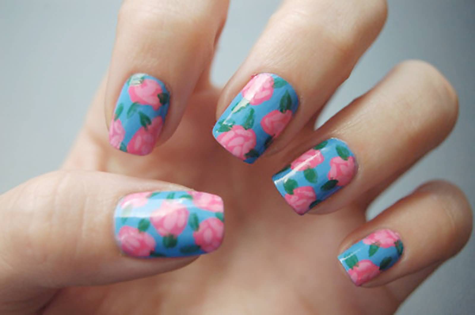 Blue Base Nails With Pink Floral Design Nail Art