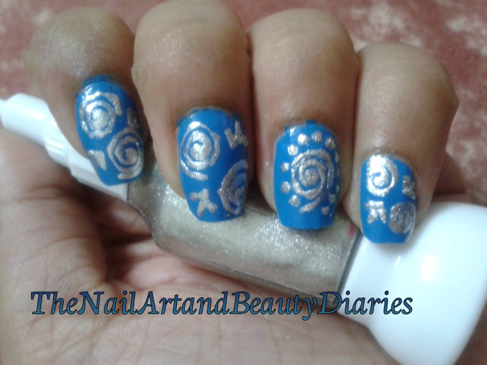 Blue Base Nails With Silver Swirls Design Nail Art
