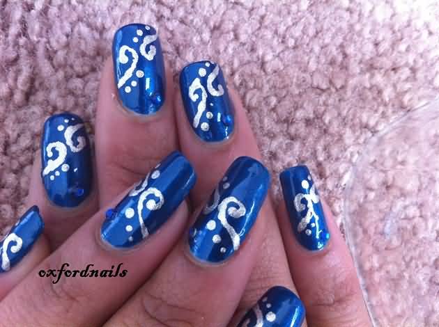 Blue Nails With Silver Swirls Design Nail Art