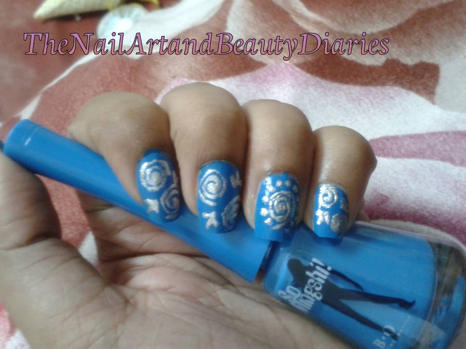 Blue Nails With Silver Swirls Nail Art