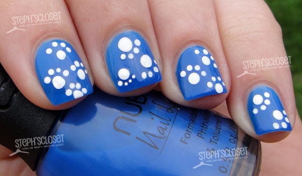 Blue Nails With White Dog Paw Print Nail Art