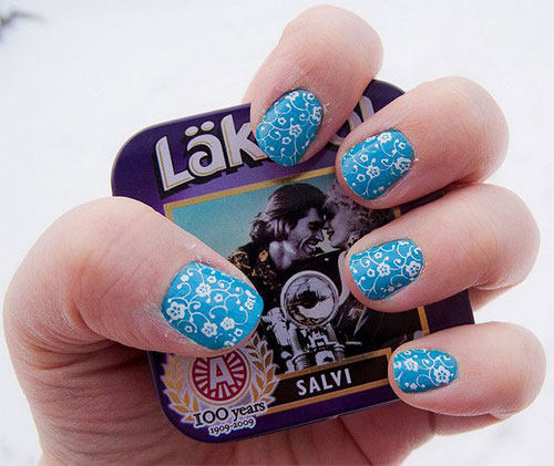 Blue Nails With White Lace Flowers Nail Art