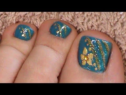 Blue Toe Nails With Gold Glitter Stripes And Flowers Nail Art Design