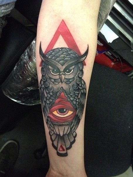 Brilliant Dark Ink Owl And Triangle Eye Tattoo On Forearm