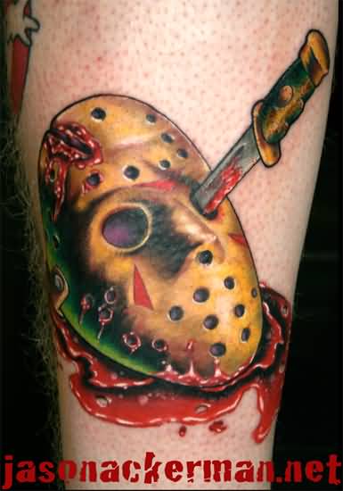 Colored Jason Mask With Knife And Blood Tattoo