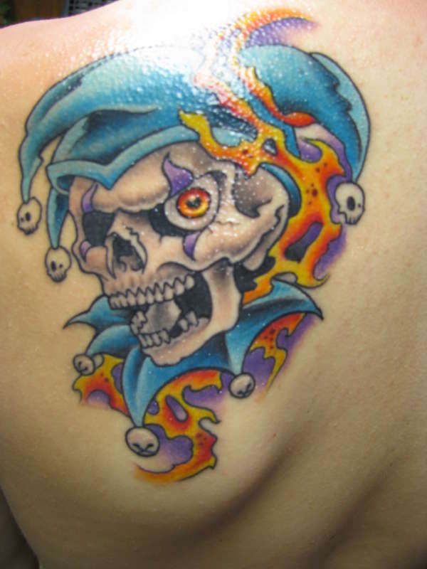 Colorful Evil Jester Skull Tattoo On Back Left Shoulder
