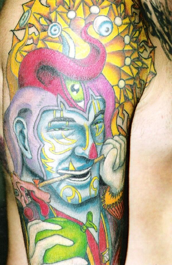Colorful Jester With Balloon And Stick Tattoo On Right Half Sleeve