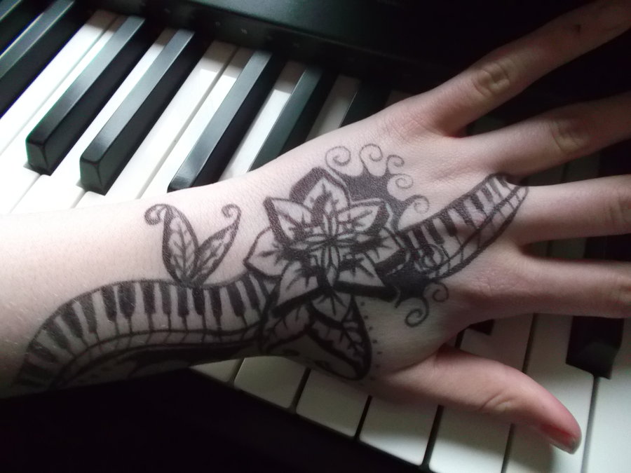 Cool Flower With Piano Keys Tattoo On Hand