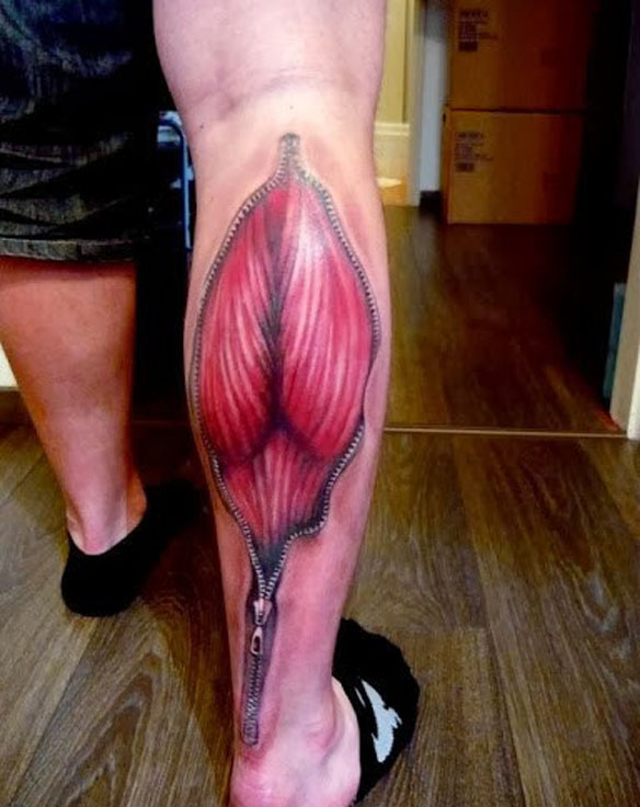 Cool Zipped Muscles Tattoo On Back Leg